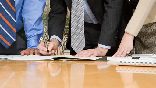 Businesspeople signing contract